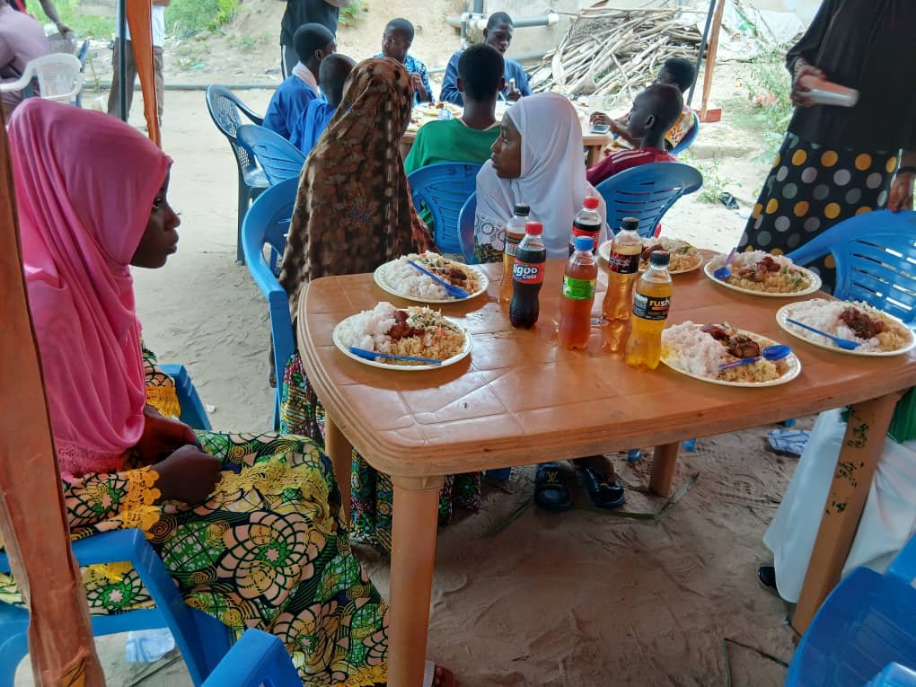 Islamic youth community gathering with food in a village